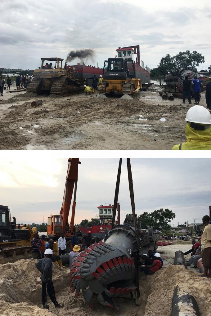 Engineers installing 浚渫船 components