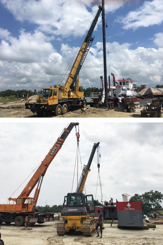 Technical team installing 浚渫船 components